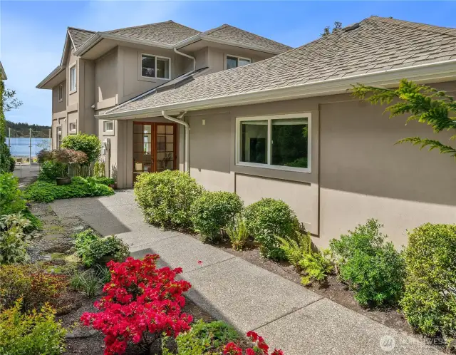 Enter this distinctive home designed with privacy and gracious spaces.