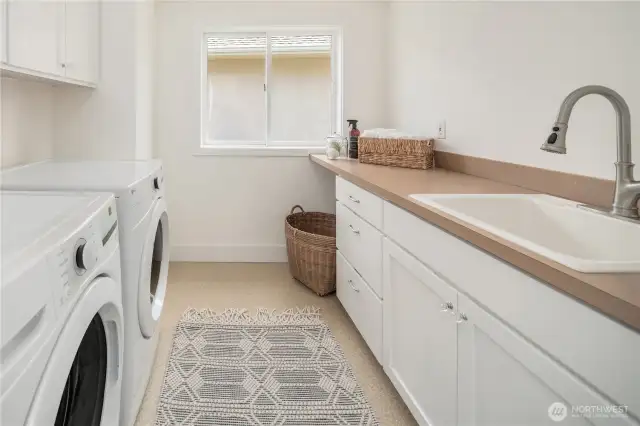Upstairs off the landing is a laundry room with brand new washer and dryer.