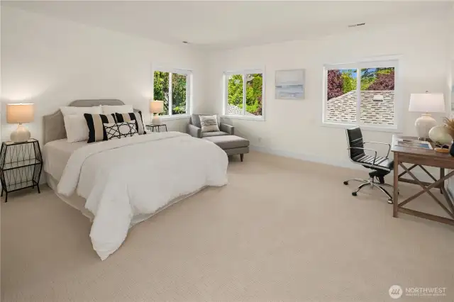 Upstairs garden bedroom with space for an office and sitting area.