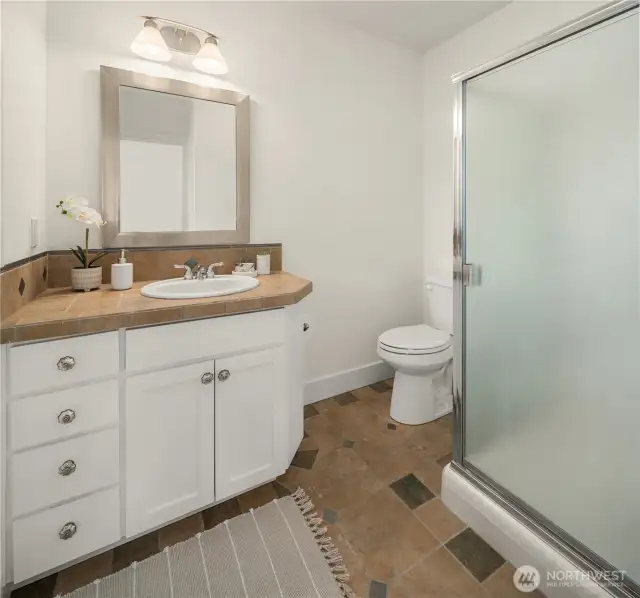 En-suite 3/4 bathroom for upstairs garden bedroom.