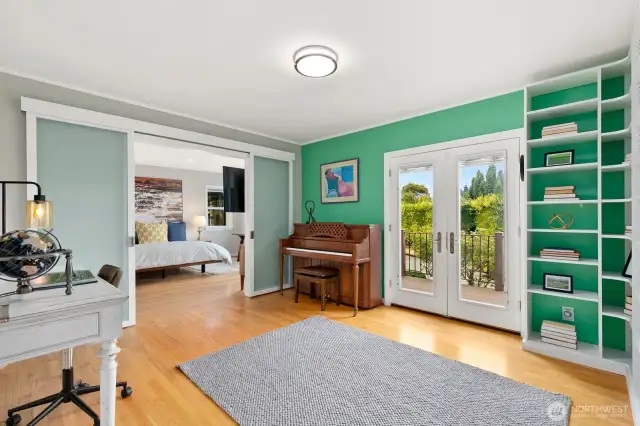 Library/flex room with built-ins provides versatility as a third bedroom on the main level.