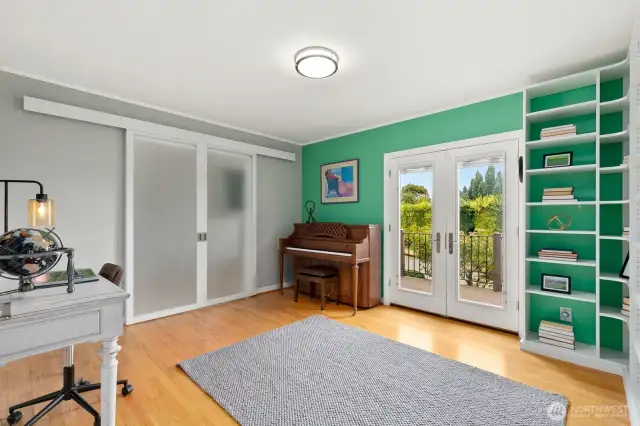 Library/flex room with built-ins provides versatility as a third bedroom on the main level.