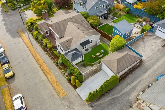 Detached garage off alley completes the package.
