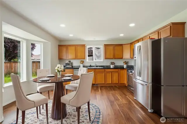 Virtually Staged View Of Great Room Towards Kitchen.