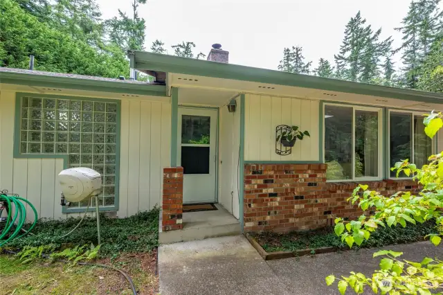 The front entryway, note the glass block wall which is the exterior wall to the guest bath.