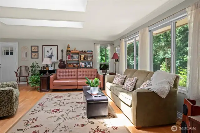 Spacious and beautiful living room, with skylights and large windows for ample sunlight!