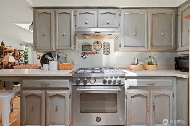 Enjoy ample counter space with solid surface countertops. New kitchen hood vent.