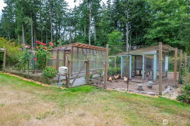 Property includes a fenced in garden area and greenhouse.