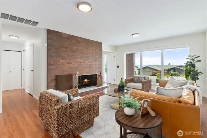 Formal Living room off of entryway with stunning fireplace perfect for warm winter nights!