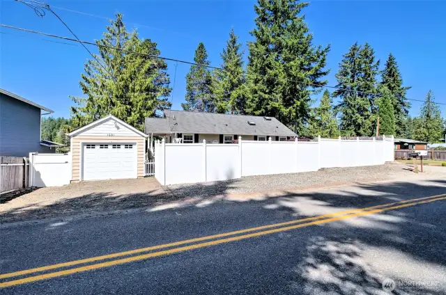 Tucked behind the whit "picket" fence is your dream lakefront home.