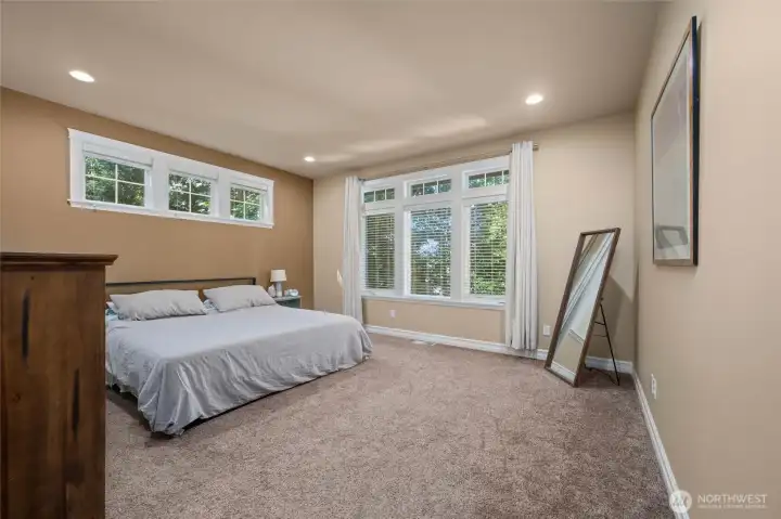 Primary bedroom with natural light and privacy..