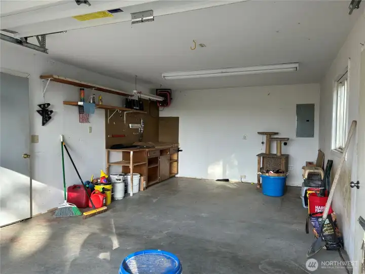 Interior of single side of garage.  Finished for shop with heat and power.