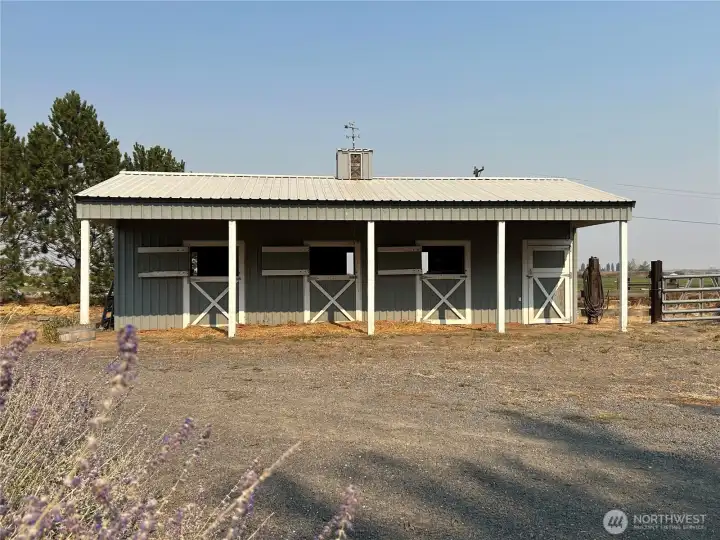 20x40 Horse barn.  Three stalls and tack/storage room.  Barn has power and water with corral opening to the 8 acre pasture.