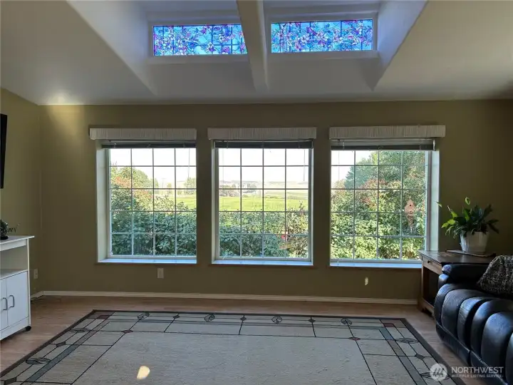 Living room off the kitchen.  Large picture windows allow for views to the east and lots of natural light.
