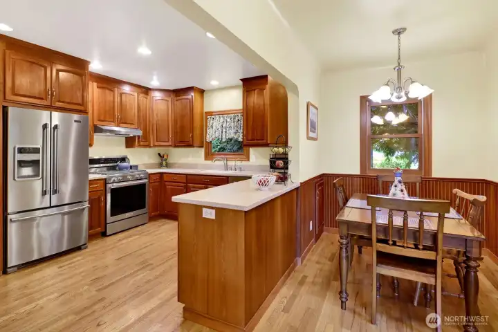 The spacious farm-style kitchen has been updated and includes an eating area