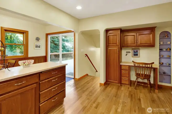 From the kitchen, access the back deck or the stairs to the basement