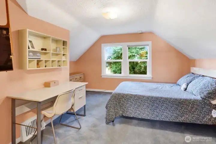 Upstairs bedroom #1 is spacious, bright and cheery