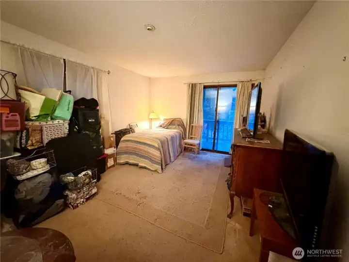 Main-level room ideal for a bedroom, office, or guest space.