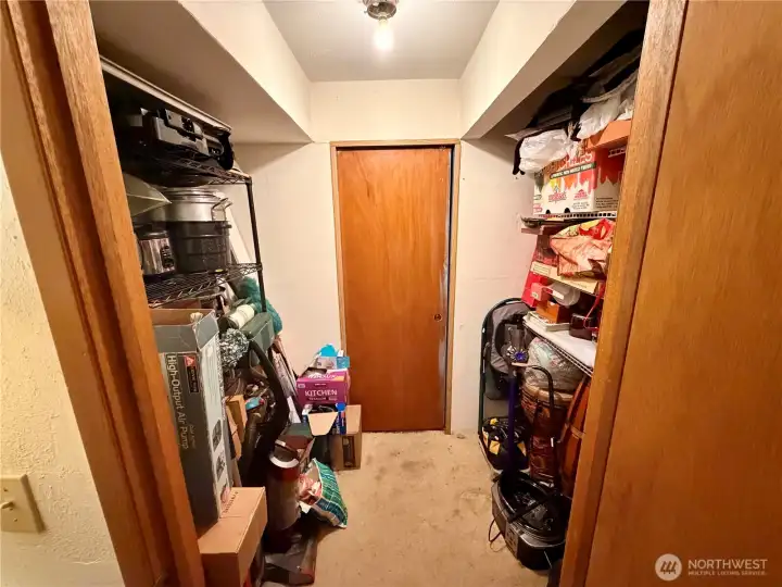 Main-level room with a walk-in closet and direct access to the bathroom.