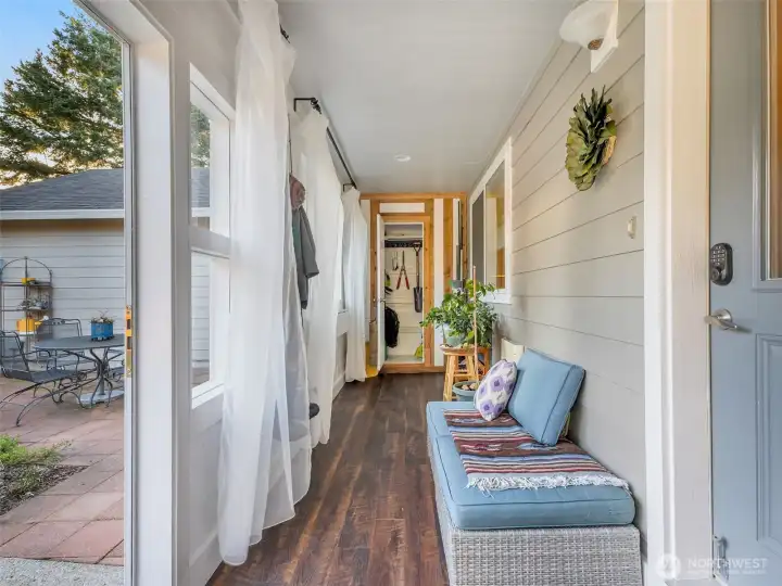 Walk into a sun room as you enter the home. This area is great for protection from the weather, storage and plants.