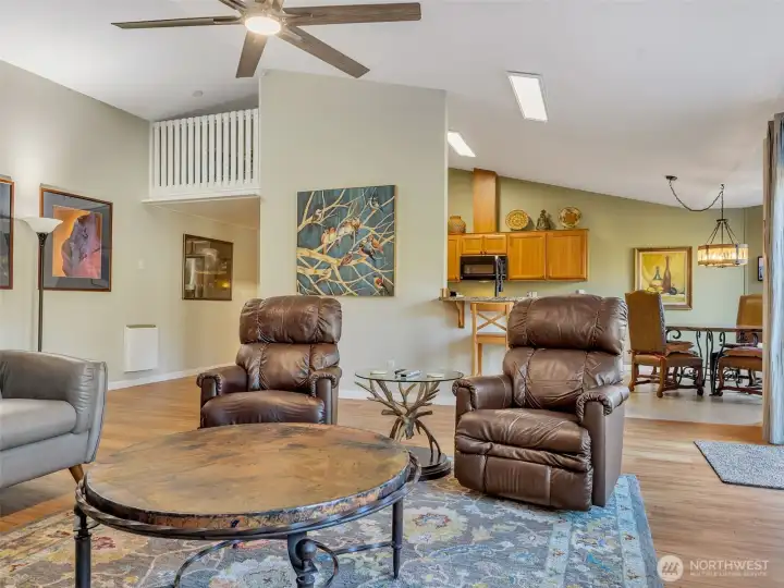 Large great room with vaulted ceilings and ample natural light.