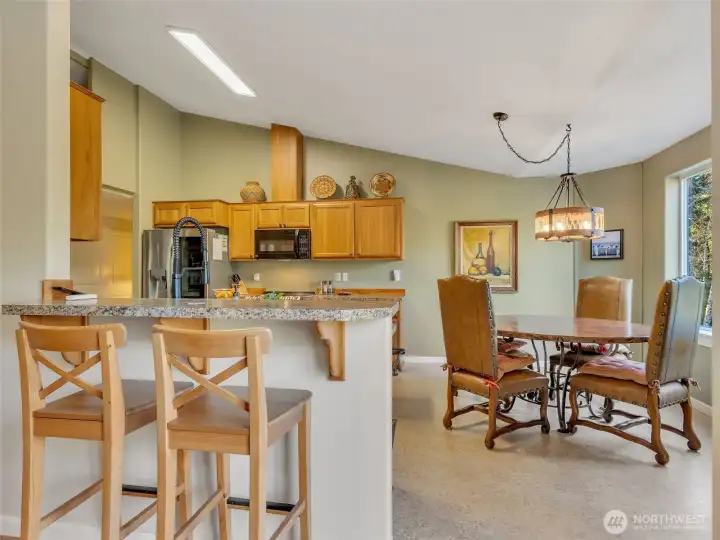sitting bar and nook of the kitchen offer ample dining space.
