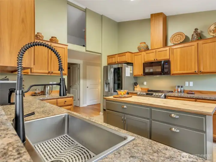 View from the sitting bar into the kitchen. A loft above the kitchen adds extra storage.
