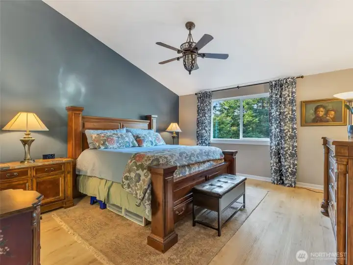 Primary bedroom suite with attached bathroom and walk-in closet.