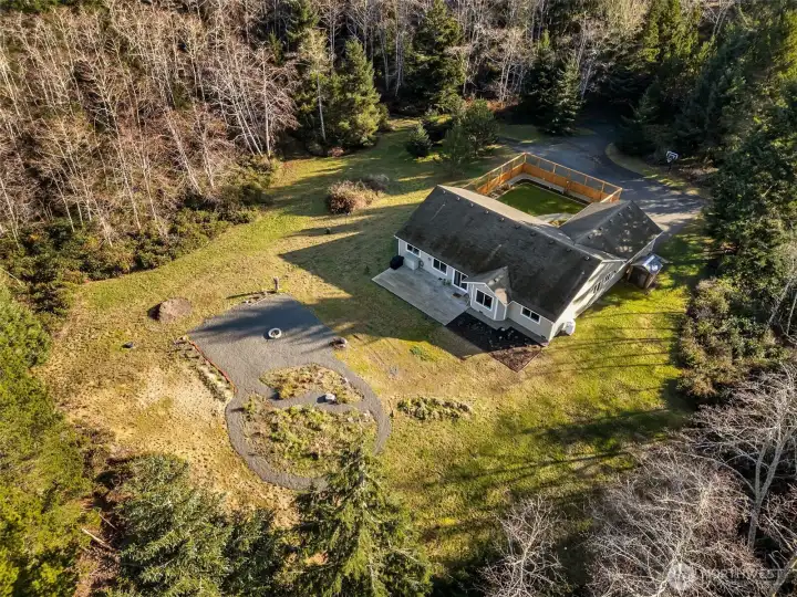 aerial shot of the property. RV parking, fire pit, gardens, room for horses or boat storage & privacy.