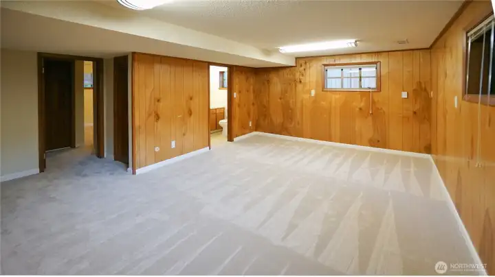 The lower level family room has an adjacent half bath.