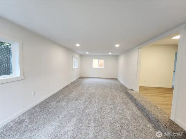 Family Room has new carpet and recessed lighting