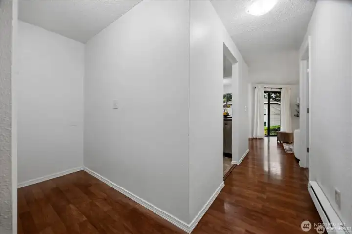 From entry door looking north down the hall to the living room