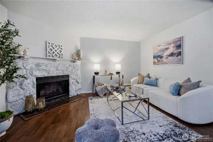 living room with wood burning fireplace
