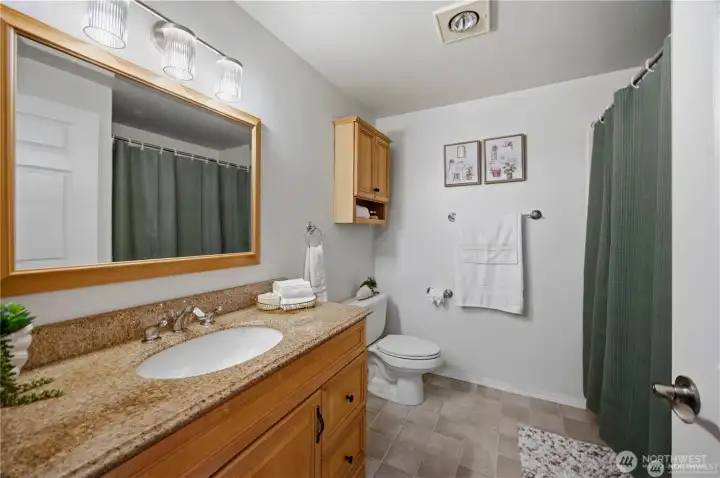 Bath with tub and shower.