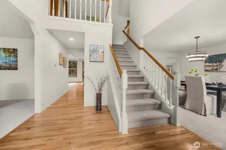 Two story entry foyer with refinished hardwood floors