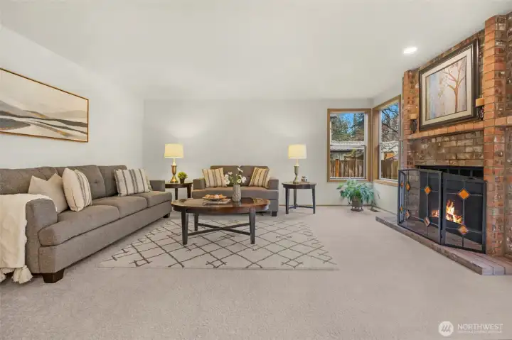 Family room with corner windows and brick fireplace