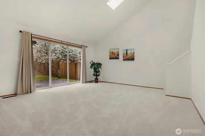 Huge main floor bonus room with sliders out to the patio and back yard