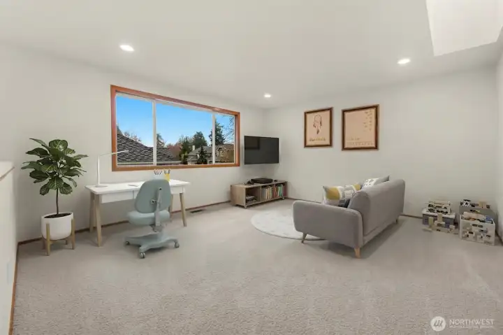 Second floor bonus room features skylight, new carpet and fresh paint. Could be ideal for a kids' play room, TV room, library, office or workout room.(digitally staged)