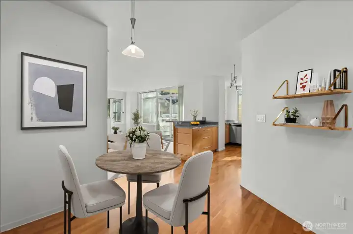 Floor-to-ceiling mirrors in dining area enhance light and space (virtually staged)
