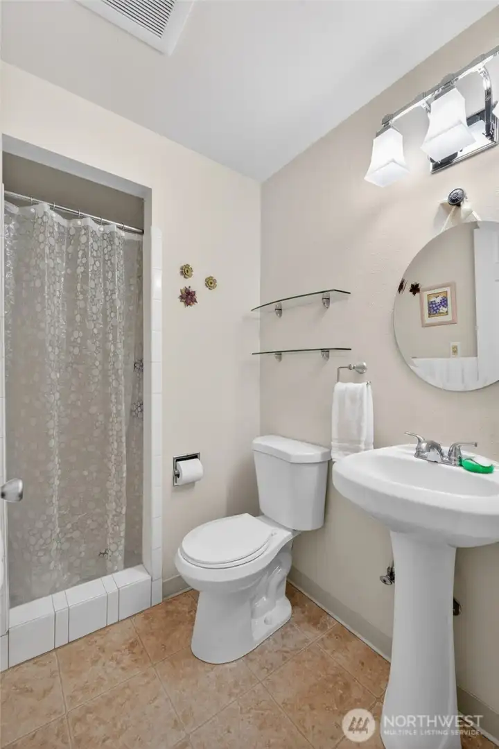 Second bathroom located in hallway.