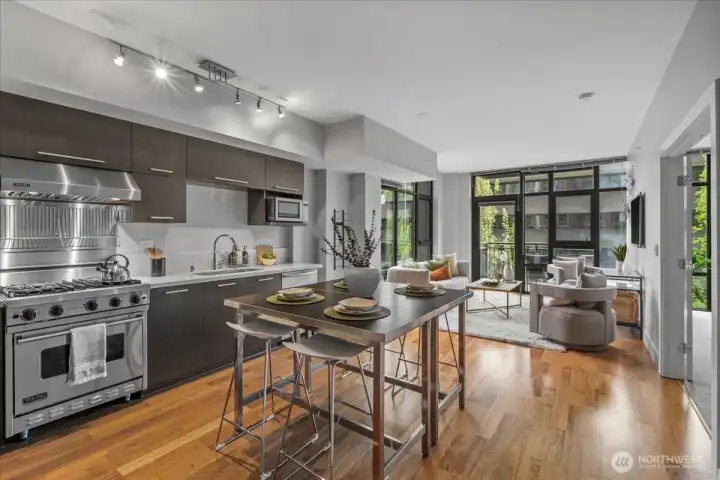 Viking gas range and Viking refrigerator. Great versatile floorplan. Beautiful extended unit with corner unit style windows. Spacious balcony with Space Needle views. French doors open to your beautiful primary suite with walk-in-closet and ensuite.