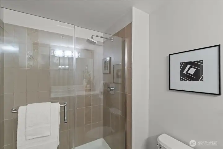 Ensuite bathroom with tile.