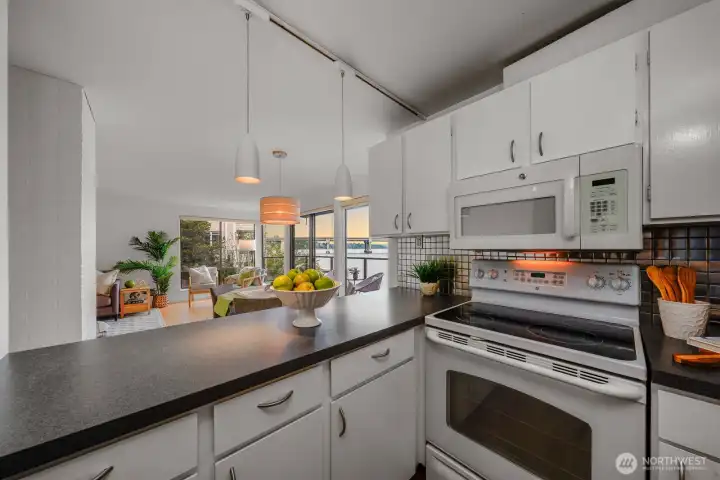 Kitchen open to dining area and living room.