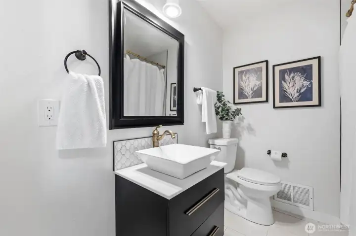 Full bathroom on the main floor with tasteful updates.