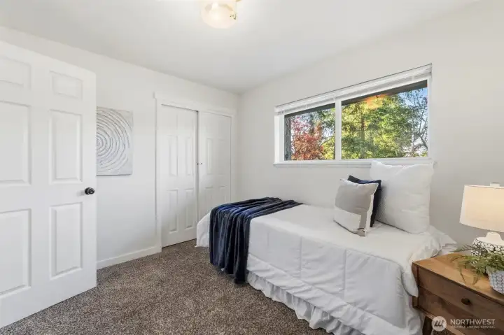 Bedroom number three on the main floor located directly across from the main floor full bathroom.