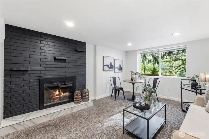 The down stair living room also features a wood burning firecplace.