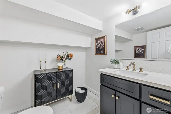 The half bath located downstairs on the lower level of the home.