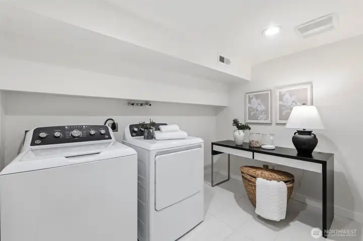 Laundry is downstairs and the washer and dryer are new and will stay with the home.