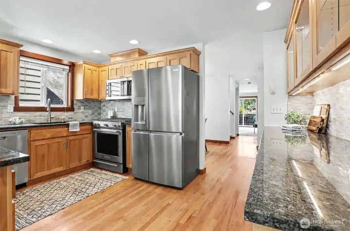 The kitchen anchors the main floor with living & dining room on either side.