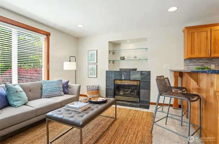 Cozy gas fireplace, large windows make this a comfy spot to relax and keep the cook company.